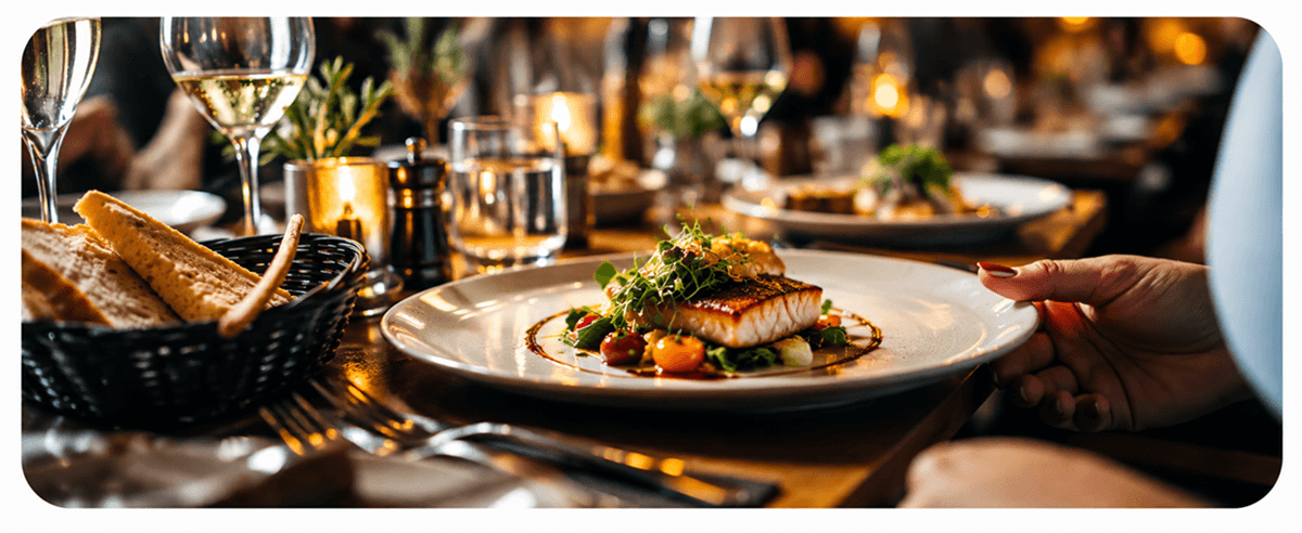A warmly lit table set for dinner at Olive & Ember